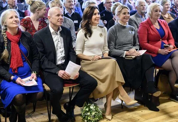 Crown Princess Mary wore Oscar De La Renta camel hair wool-blend cape, CO wool sweater, Naledi Copenhagen clutch