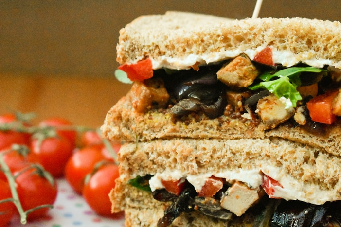 Roasted Vegetable and Tofu Sandwiches. A recipe for luxurious veggie sandwiches. Soft wholemeal bread filled with mustard, salad leaves, roasted vegetables and tofu and cream cheese