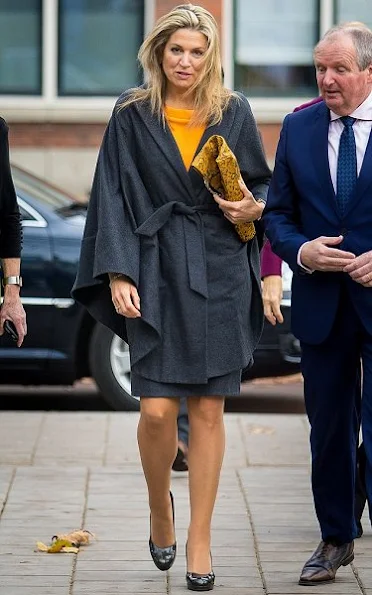 Queen Maxima wore Natan wool skirt and Natan yellow color top, Gold earrings, Cartier watch, Christian Louboutin Women Shoes, style royal