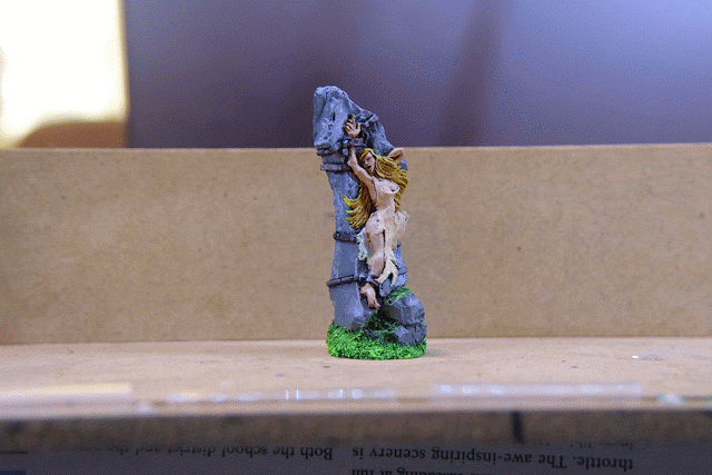 Trixie on the rock Maiden chained to monolith