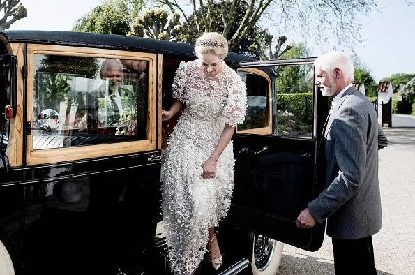 Princess Alexandra is wearing the Ahlefeldt-Laurvig-Bille floral tiara, wedding lace dress. Princess Nathalie and Princess Sumaya