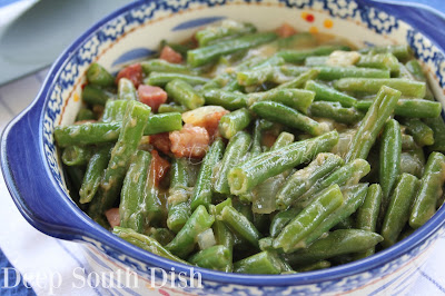 Green beans with onions and tasso or andouille, smothered in a light roux gravy.