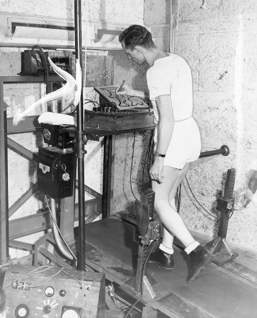 Treadmill Test for cardiovascular health.  Early designs in 1949, by Dr. Robert A. Bruce continued improvements with monitoring functioning. Photo from 1952. The Mill, The history of the treadmill and the best of treadmill dancing. marchmatron.com
