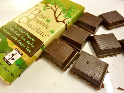 with a delicious piece of Dina's organic dark chocolate with Green Tea