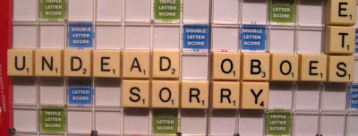 Part of a Scrabble board with words that read UNDEAD OBOES SORRY