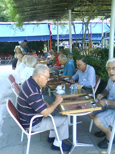 A passion for backgammon..Tavli ! Kolonaki cafe and bar, opposite Park Irene Loutraki Greece Photo Greeker than the Greeks A passion for backgammon..Tavli ! Kolonaki cafe and bar, opposite Park Irene Loutraki Greece Photo Greeker than the Greeks
