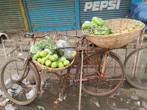 "Cycle Hawker" selling vegetables in Paltan Bazaar of Guwahati.