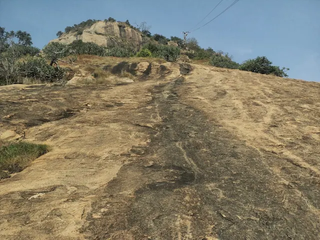 The steep, challenging rock section requiring three points of contact