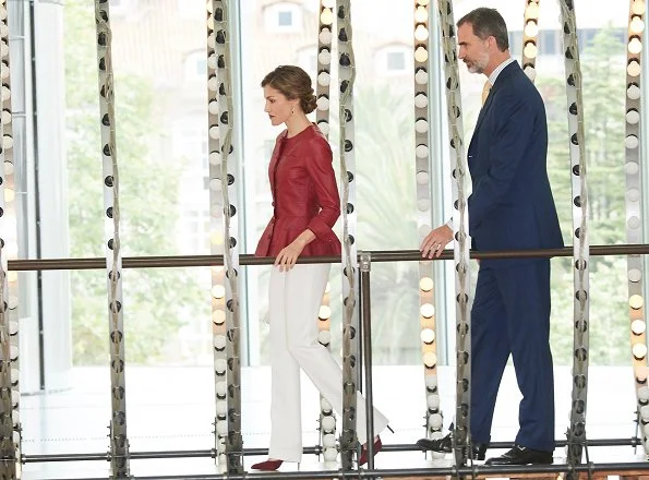 Queen Letizia wore CAROLINA HERRERA Peplum Jacket, LODI Pumps Shoes, carries UTERQUE Snakeskin Clutch