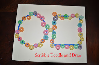 fine motor activities use fingers to place fruit loops on drawn shapes