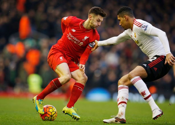 Adam Lallana in action with Chris Smalling