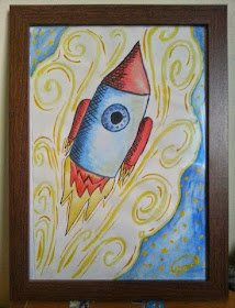 Elspeth's rocket. On the fridge for a year and now in a frame