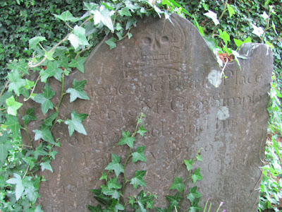 An ivy-covered gravestone at Donnybrook Cemetery Dublin