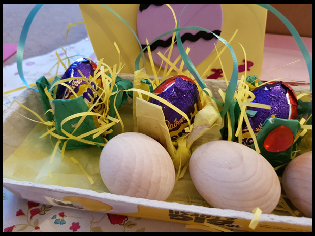 Hang Cadburys eggs in mini baskets from the tree.  Kids don't think to look up