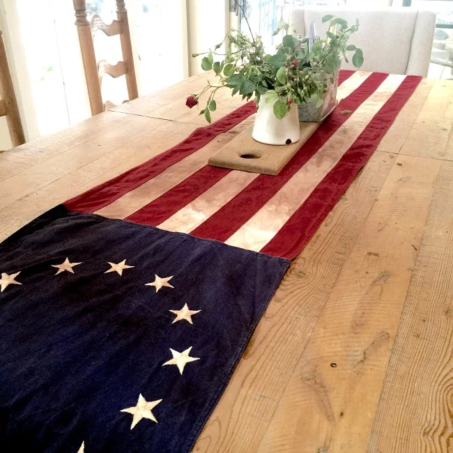 American Flag on table with flowers.