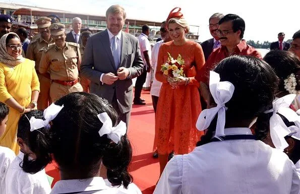 Queen Maxima wore a lace midi dress by Natan, Queen wore a Natan pumps and Ole Lynggaard diamond earrings