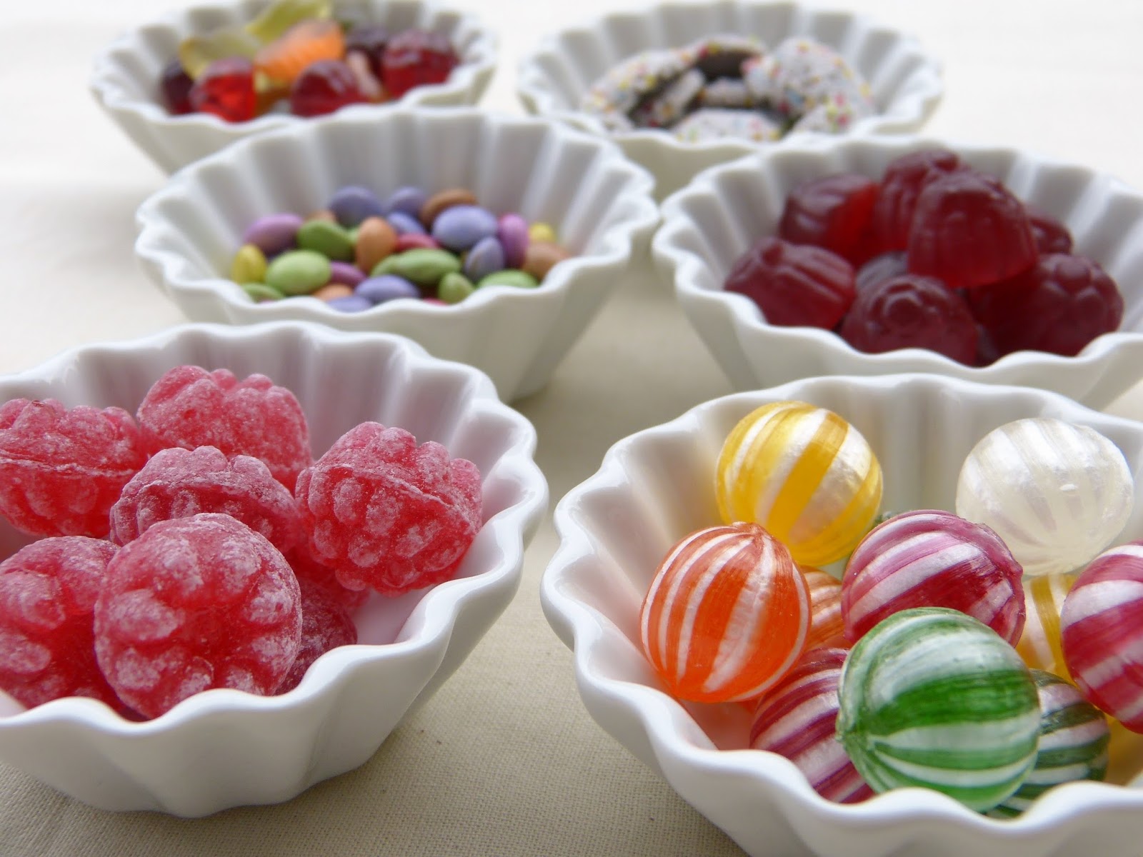 Selection of sweets in little white dishes