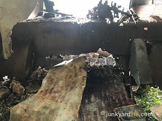 Inside the Kombi is a mess of rusted-through metal. The floor is gone and the shell is unstable.