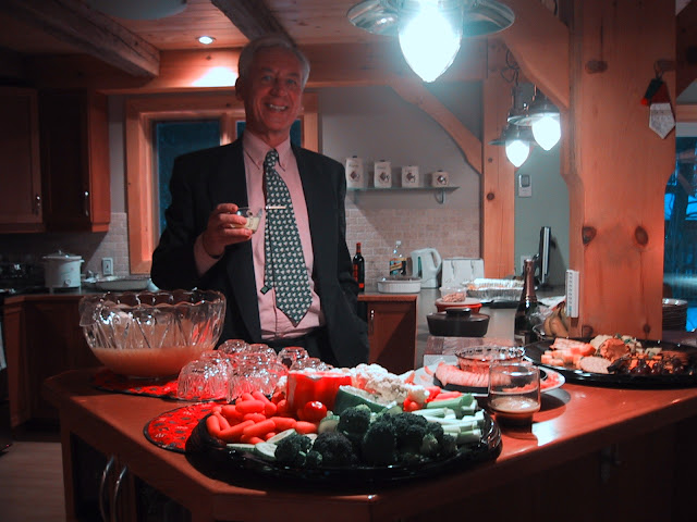 Keith toasts the Christmas singing season at Josée's annual Xmas party