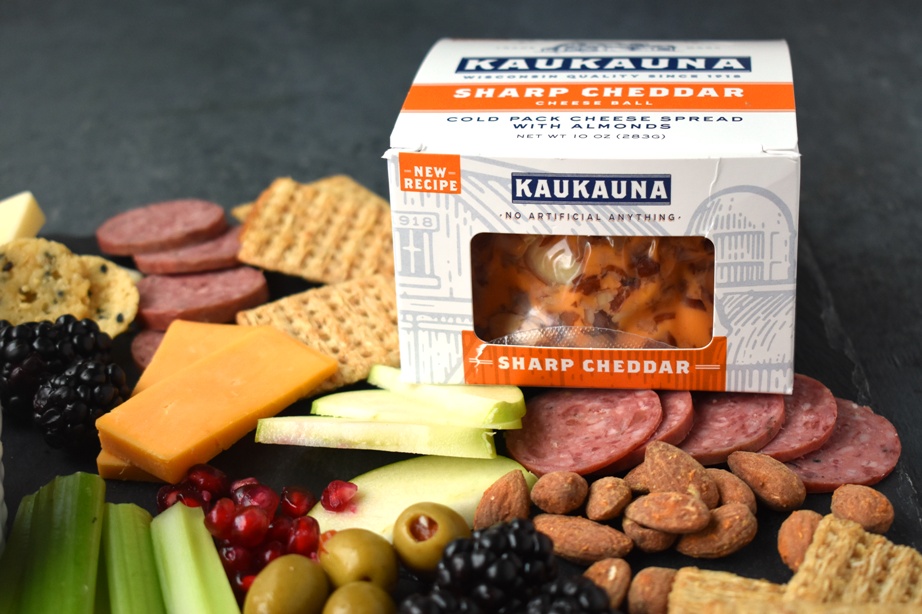 The Ultimate Holiday Cheese Board is loaded with your favorite cheeses, berries, pomegranates, apples, nuts, sausages, homemade Greek yogurt ranch, vegetables, crackers, olives, pickles and more for a super easy holiday appetizer that everyone will love! #appetizer #holidays #cheese #cheeseboard #entertaining #easyappetizer #christmas #holidayfood Kaukauna Cheese Ball