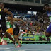 As it happened: Bolt powers to third-straight 100m gold on 9 days