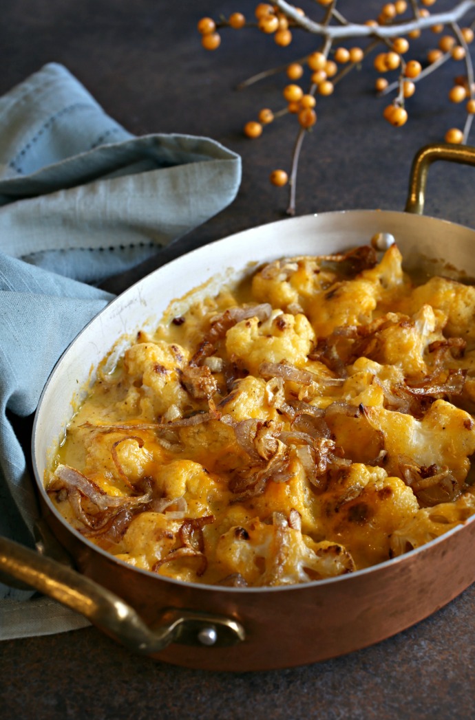 Recipe for a cheddar cheese cauliflower gratin topped with fried shallots.