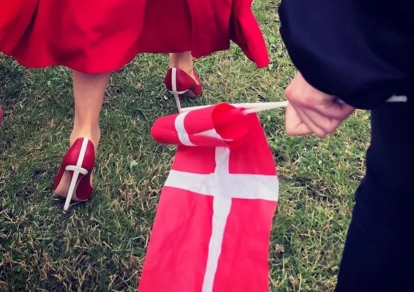Crown Princess Mary wore Raquel Diniz Armonia silk-georgette dress. Danish flag