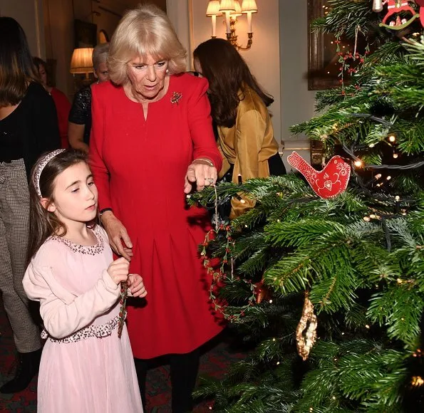 The Duchess of Cornwall is the patron of Helen and Douglas House and Roald Dahl Charity. red dress