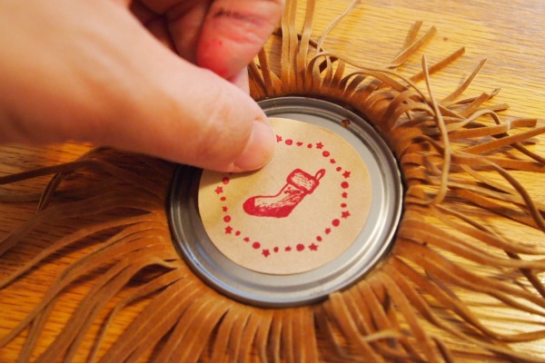 Final touches to the Fringed Juice Lid Ornament adding these stickers made with PSAEssentials "North Pole"  stamps. They give it a definite rustic feel. 