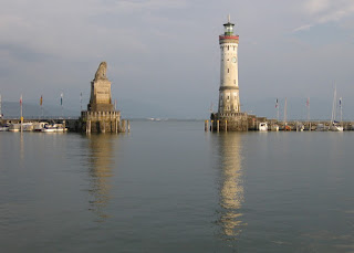 View of the lion and new lighthouse at entrance to Lindau harbor, Lindau, Germany