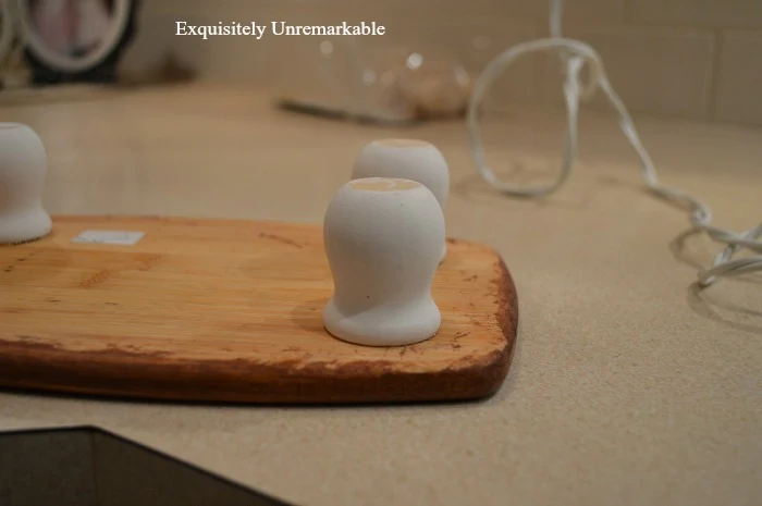 Making A Wooden Trivet by adding small wooden cup legs to the bottom of cutting board