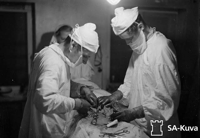 Doctors perform abdominal surgery on a wounded captain.
