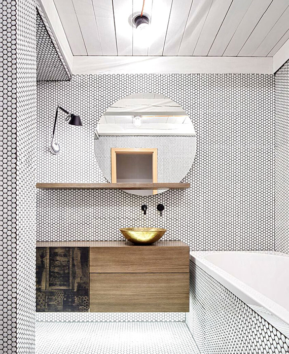 Contemporary bathroom with white penny tiles, design by Formafatal
