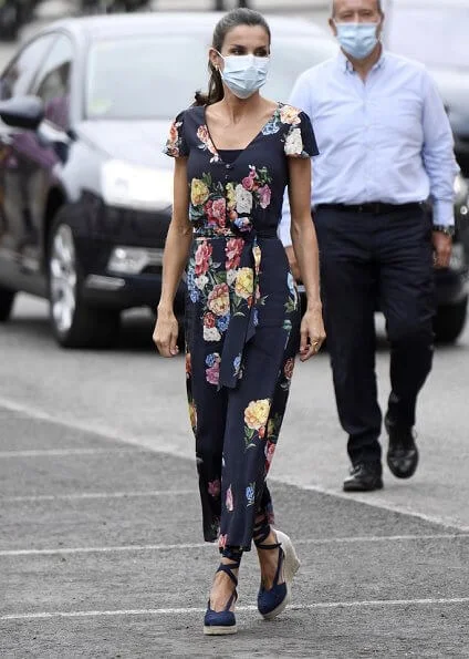 Queen Letizia wore a floral jumpsuit from Uterque, which she had worn before, and espadrille wedges from Macarena