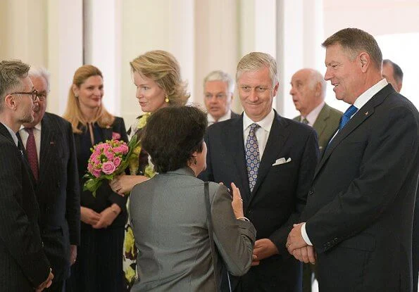 Queen Mathilde wore Erdem Finn dress bloomsbury yellow satin. Mr. Klaus Iohannis, President of Romania