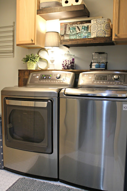 Laundry room with floating shelves