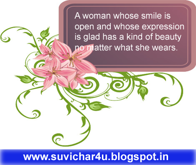 A waoman whose smile is open and whose expression is glad has a kind...