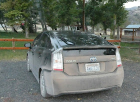 Black Toyota Prius so dust covered it looks biege-gray