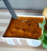 South Africa is famous for kei-apples or Kei-appel and Kei Apple Tomato Chutney is a sort of combination pickle and preserve that goes well with grilled meats.