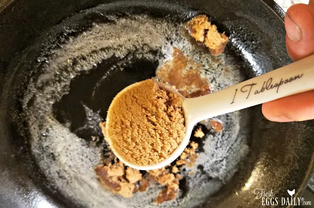 adding brown sugar to melted butter