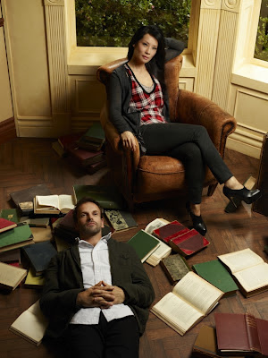 Jonny Lee Miller and Lucy Liu as Sherlock Holmes and Joan Watson in Elementary Pilot Episode Jonny Lee Miller and Lucy Liu as Sherlock Holmes and Joan Watson in Elementary Pilot Episode