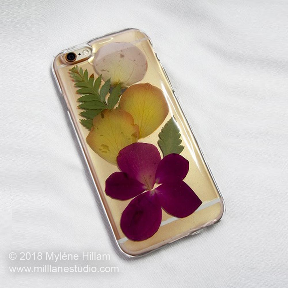 Dried flowers and petals from Mother's Day bouquet embedded in resin on a mobile phone case