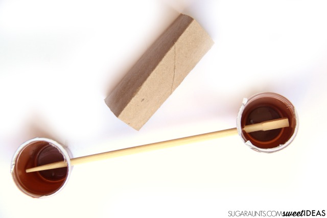 Build a lever and fulcrum with recycled materials in this STEM activity that is perfect for kids to do over the summer at home or at summer camp to prevent the summer slide!