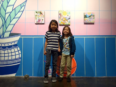 ziggy and rocket checking out art show west hollywood