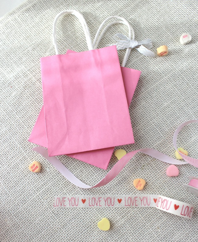 Golden arrows and pink hearts and gift bags