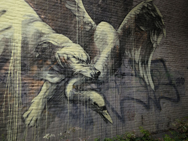 "Alas! how pitiful." street art  Mural By Faith47 In Heerlen, Netherlands. dog and swan
