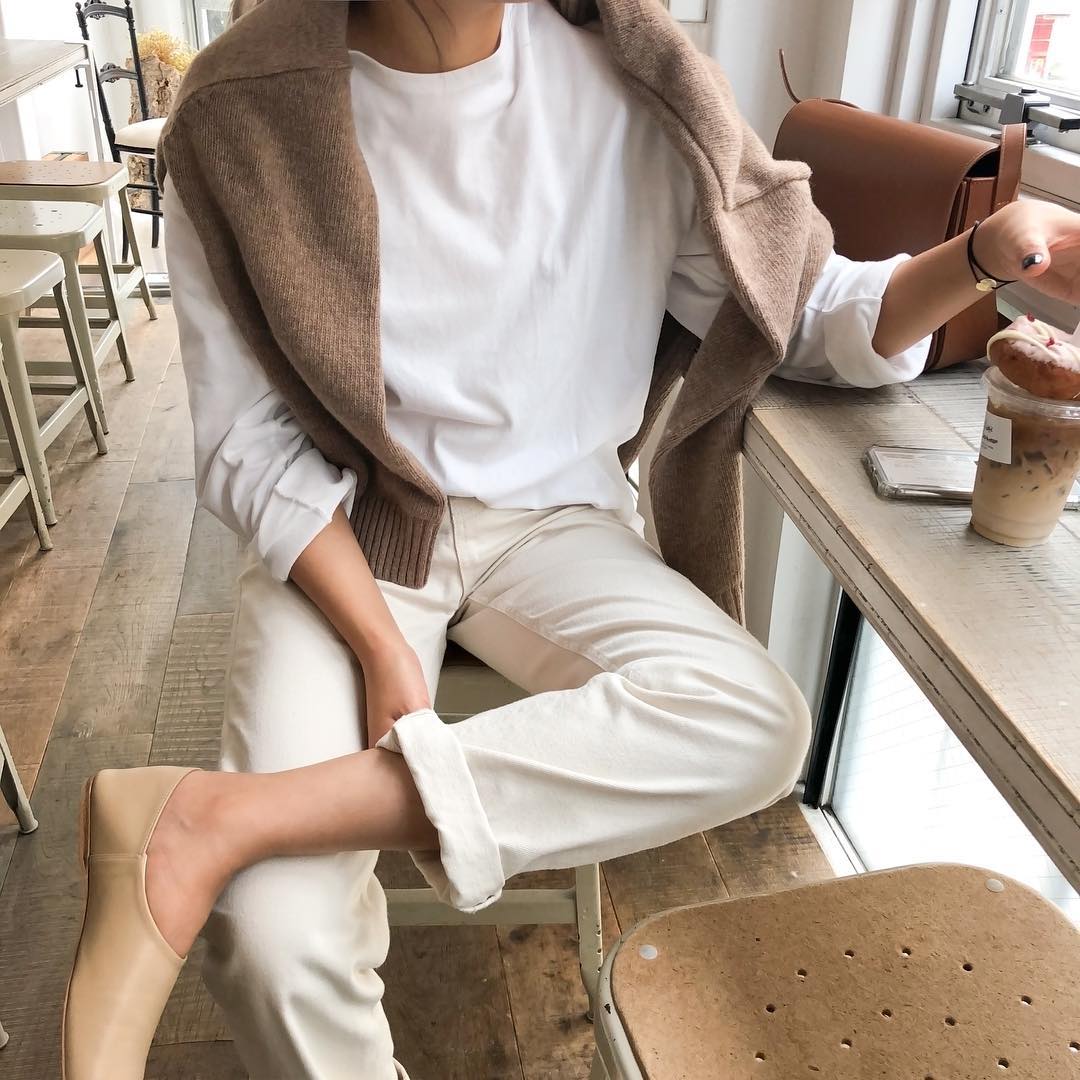Neutral Spring Outfit for Self-Quarantine: Brown Sweater, White Longsleeve T-Shirt, Off-White Jeans, and Neutral Flats