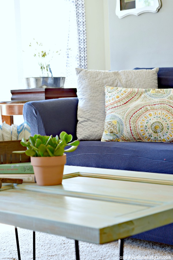 Add rustic farmhouse charm to your home with this easy DIY coffee table made from an old door!