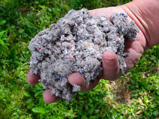 hand holding dusty mulch