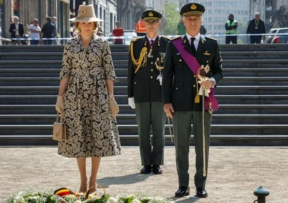 Prime Minister Sophie Wilmes. Queen wore a patterned coatdress by Armani, Natan, Dries Van Noten, Diane Von Furstenberg